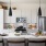 open kitchen with under cabinet lighting and access to living room