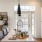 open kitchen with under cabinet lighting and access to living room