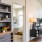 open living space with large, picture windows and access to a bedroom