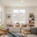 open living space with large, picture windows and access to kitchen
