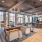 wood beam ceiling in clubhouse with fireplace, kitchen and ample seating