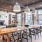 wood beam ceiling in clubhouse with fireplace and ample seating